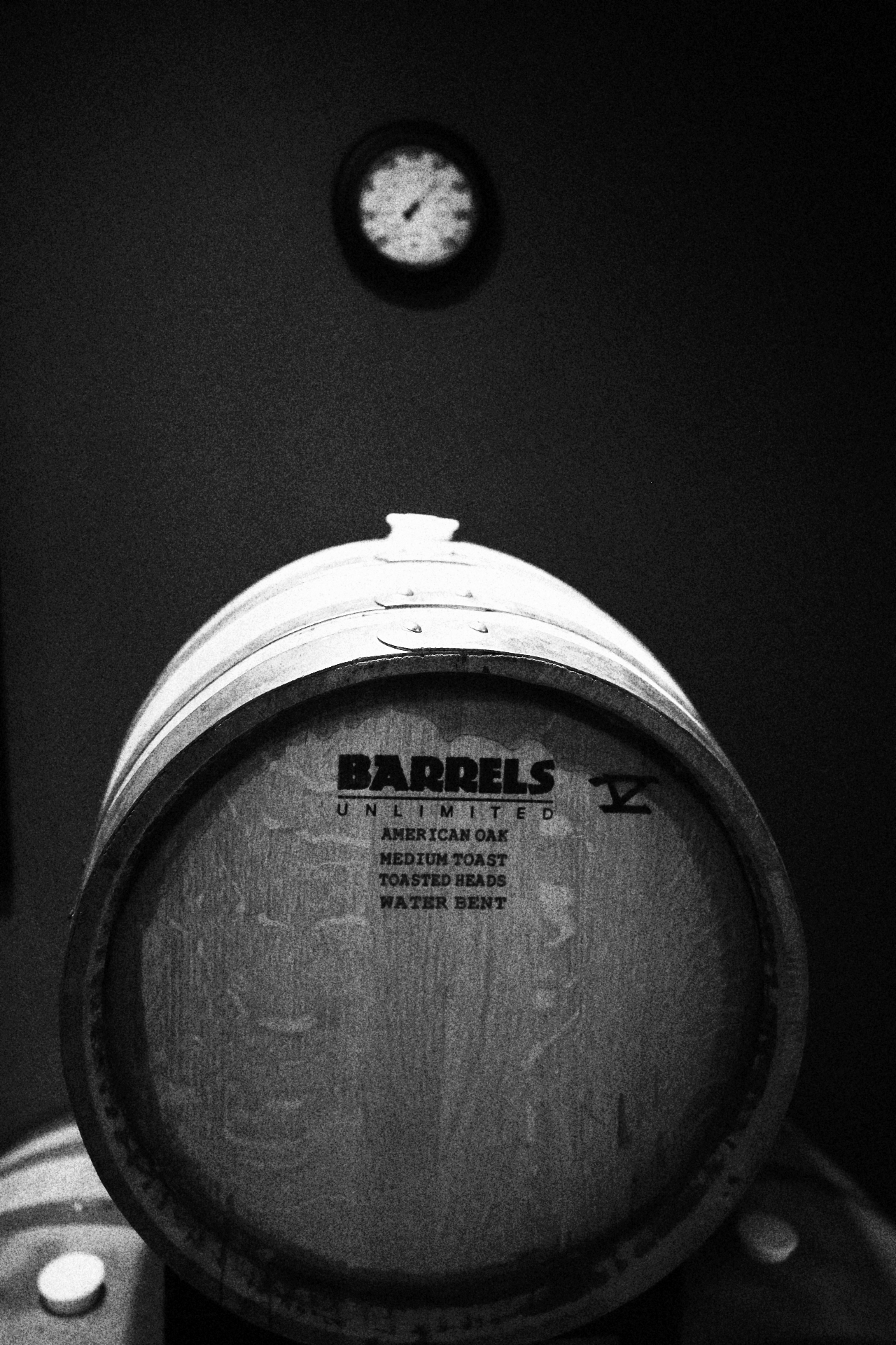 Barrel face resting beneath the cellar wall clock